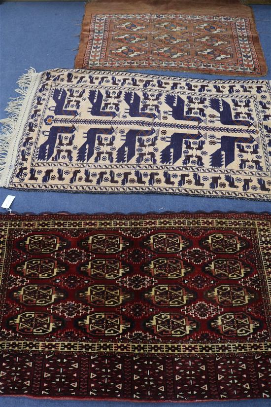 A Bokhara rug and two others, 110 x 75cm, 140 x 80cm & 125 x 70cm